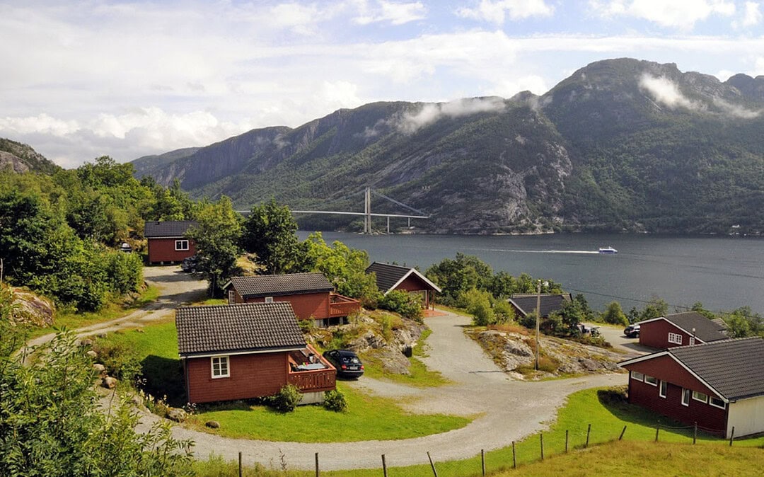 Cabins at Lysefjorden Hyttegrend overlooking Lysefjorden with mountains and bridge in the background