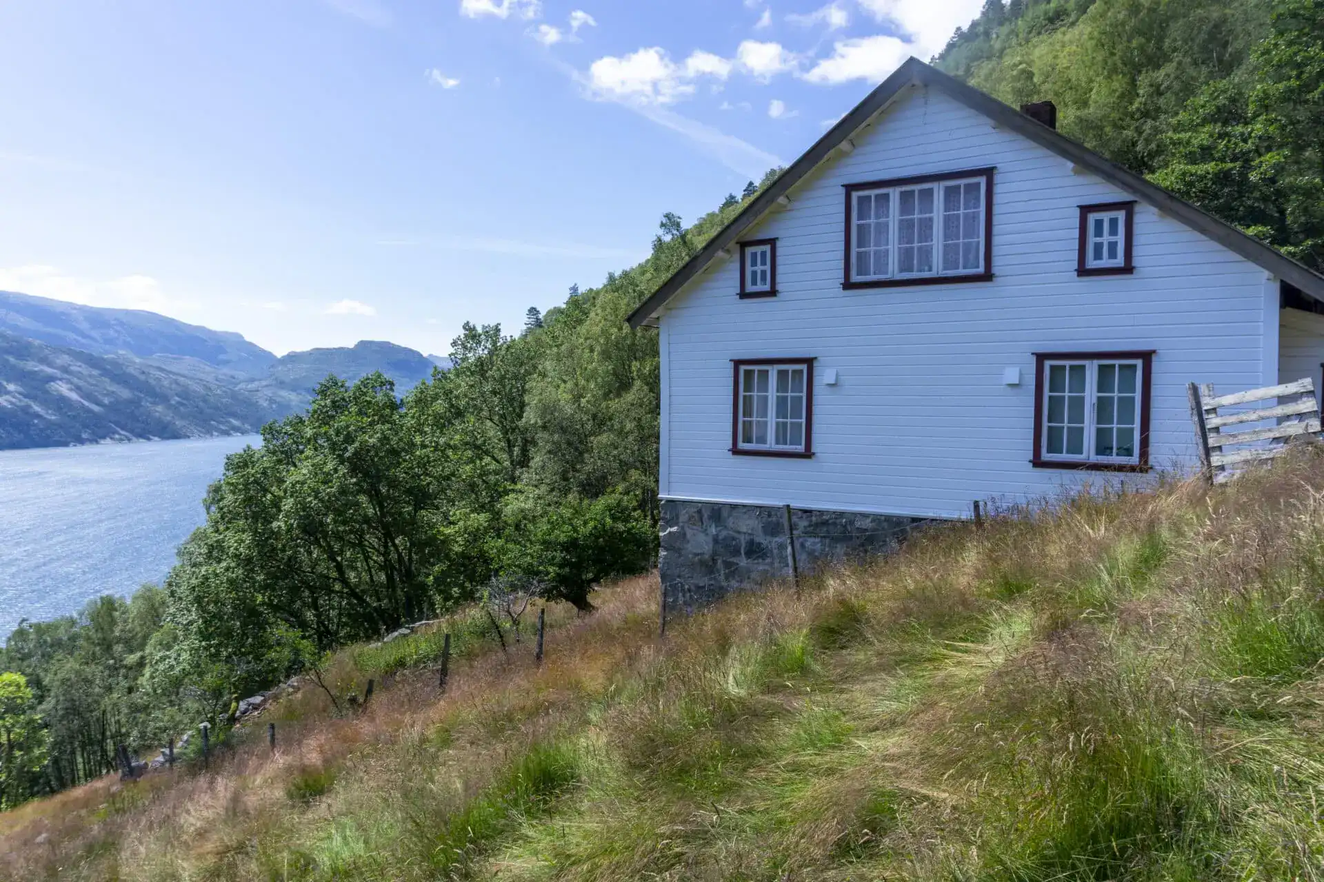Historic white farmhouse at Bratteli overlooking the Lysefjord